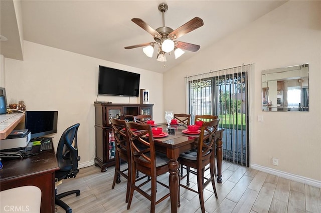 dining room with ceiling fan, baseboards, vaulted ceiling, and wood finish floors