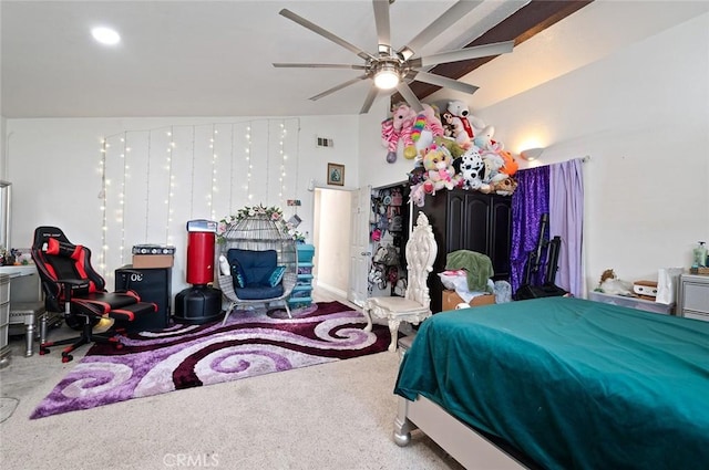 bedroom with lofted ceiling, ceiling fan, carpet flooring, and visible vents