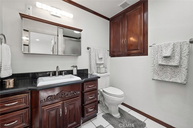 bathroom with visible vents, toilet, tile patterned flooring, crown molding, and vanity