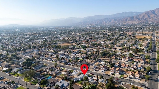 27447 Cypress St, Highland, CA 92346 - aerial view of property and surrounding area featuring a mountainous background and nearby suburban area