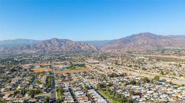 27447 Cypress St, Highland, CA 92346 - aerial view of property and surrounding area featuring a mountain backdrop and nearby suburban area