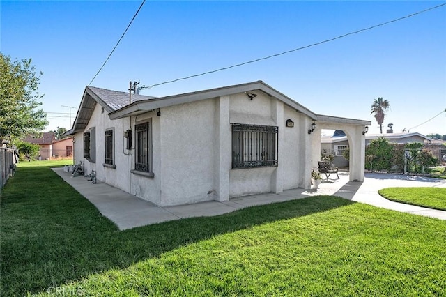 27447 Cypress St, Highland, CA 92346 - view of home's exterior featuring stucco siding and a patio