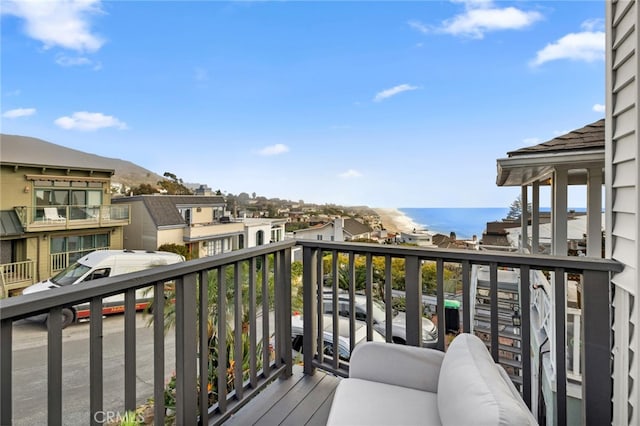 balcony featuring a water view