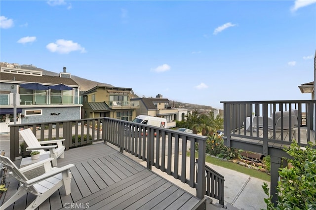 wooden terrace with a residential view