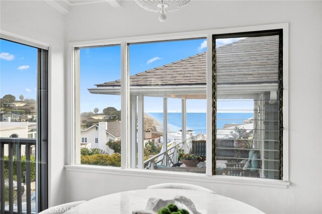 sunroom with a water view