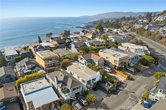 drone / aerial view featuring a residential view and a water view