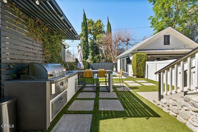 view of patio featuring fence, grilling area, and area for grilling