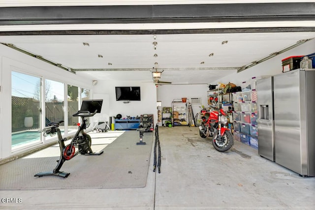 garage with stainless steel fridge