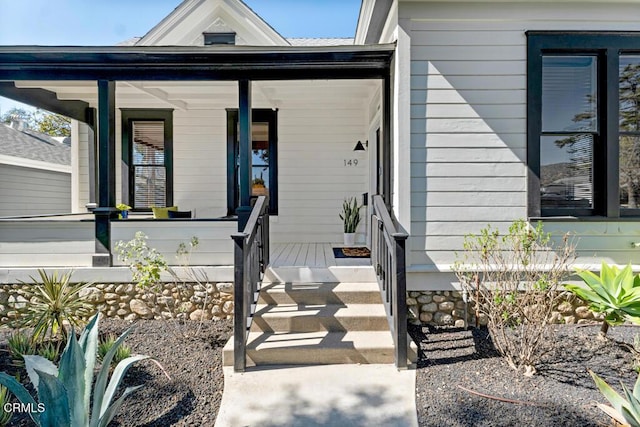 entrance to property with a porch