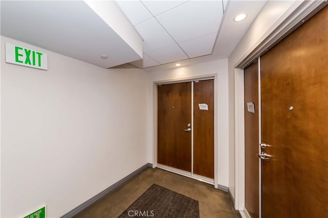 doorway to outside with baseboards and recessed lighting