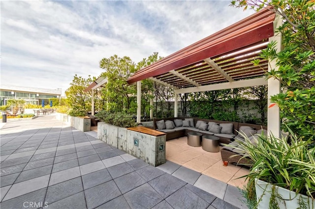 view of patio featuring a pergola and an outdoor hangout area