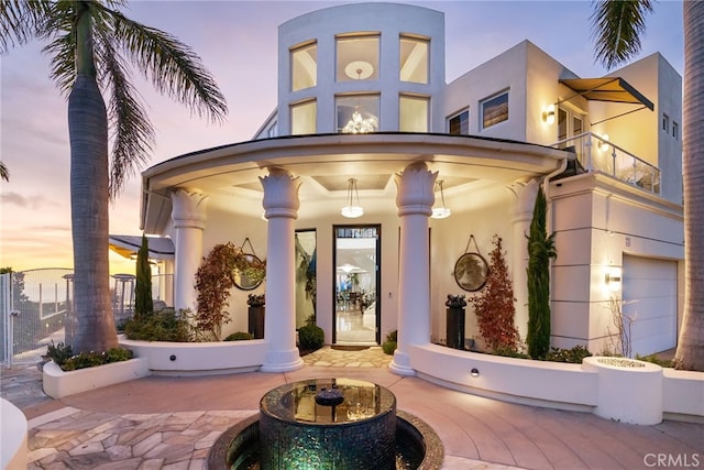 view of exterior entry featuring stucco siding