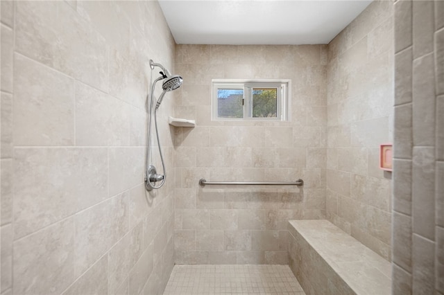 bathroom with tiled shower