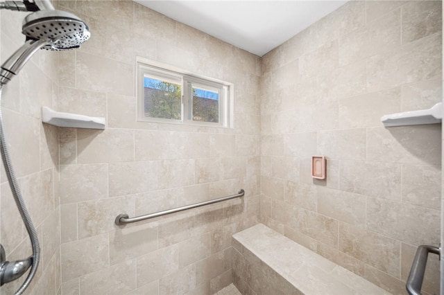 full bath with a tile shower