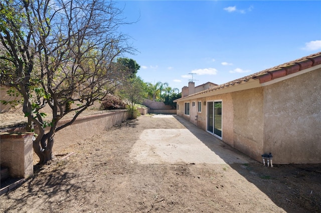 view of yard featuring a patio and fence