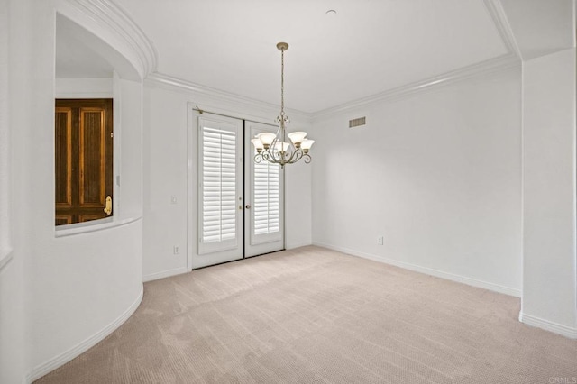 spare room featuring a notable chandelier, light colored carpet, visible vents, baseboards, and ornamental molding