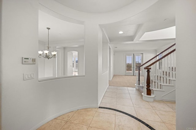 tiled foyer entrance featuring stairs, recessed lighting, a notable chandelier, and baseboards