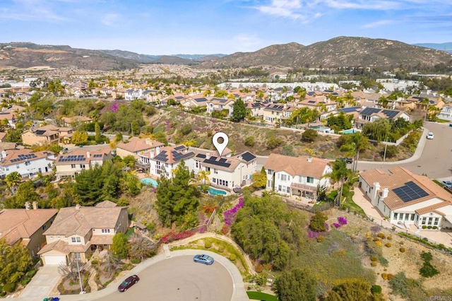 drone / aerial view with a residential view and a mountain view