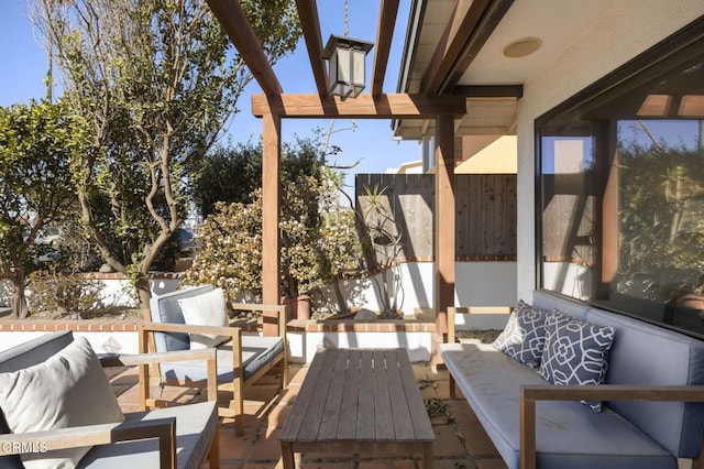 view of patio with an outdoor hangout area and fence