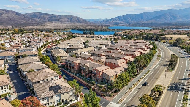 bird's eye view with a residential view and a water and mountain view