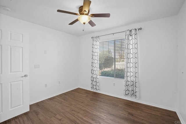 unfurnished room with ceiling fan, baseboards, and wood finished floors