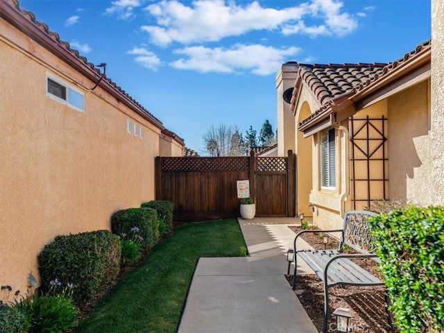 view of yard with a patio and fence