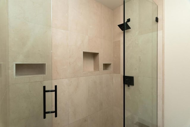 bathroom with a shower stall