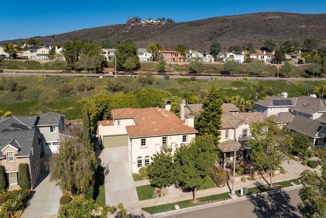 bird's eye view with a residential view and a mountain view