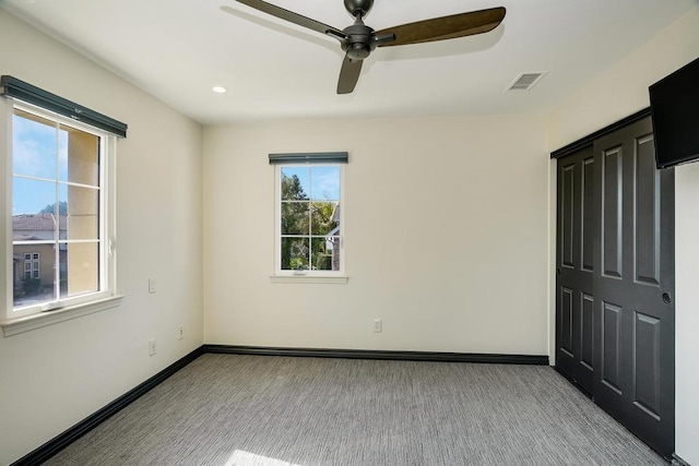 carpeted spare room with visible vents, recessed lighting, baseboards, and ceiling fan