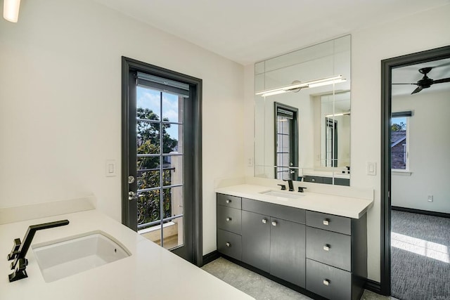 full bath with baseboards and vanity