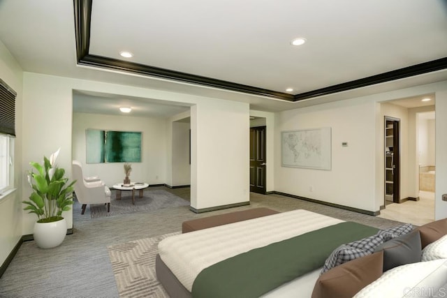 carpeted living area featuring recessed lighting, baseboards, and a tray ceiling