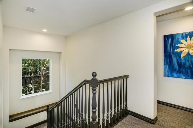 stairs featuring visible vents, recessed lighting, baseboards, and carpet floors