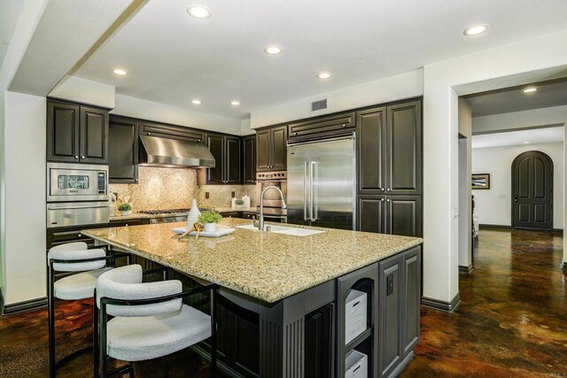 3518 Camino Cereza, Carlsbad, CA 92009 - kitchen with extractor fan, built in appliances, a sink, a warming drawer, and finished concrete floors