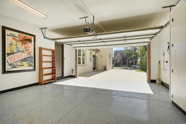 3518 Camino Cereza, Carlsbad, CA 92009 - garage featuring baseboards and a garage door opener