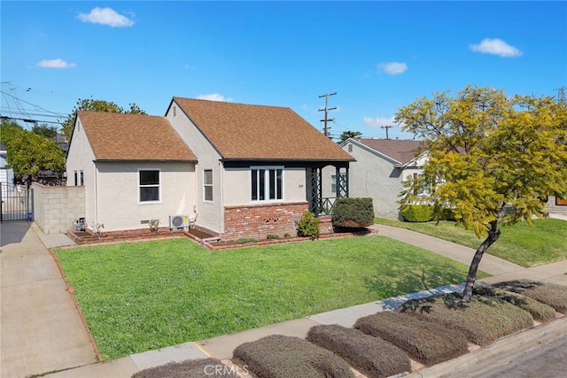 single story home with brick siding, a shingled roof, fence, stucco siding, and a front yard