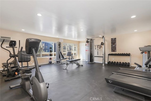 gym featuring recessed lighting and baseboards