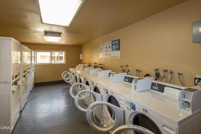 community laundry room with stacked washer / dryer and washer and dryer