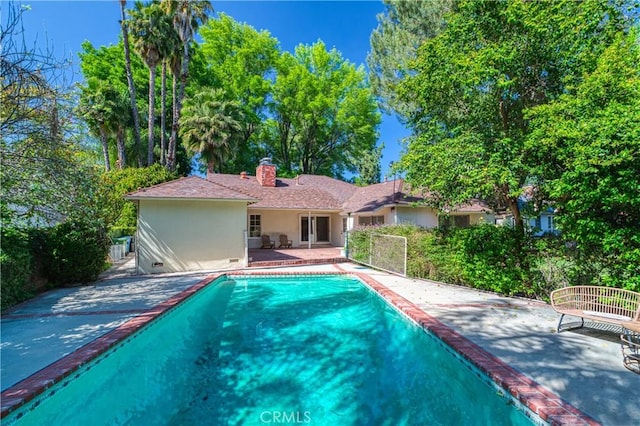 outdoor pool featuring a patio