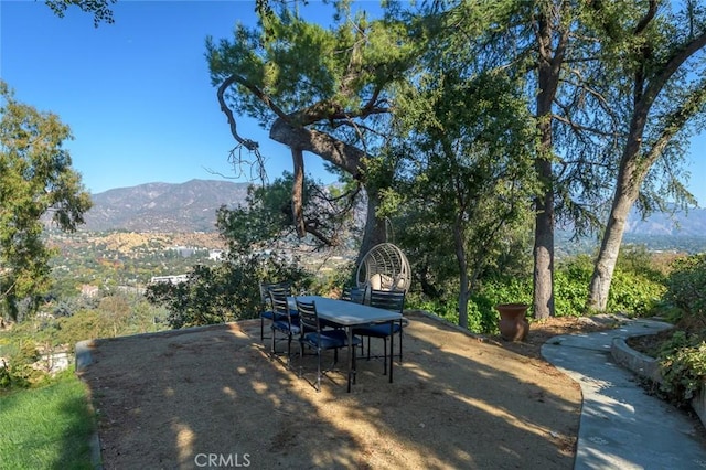 view of patio / terrace featuring a mountain view