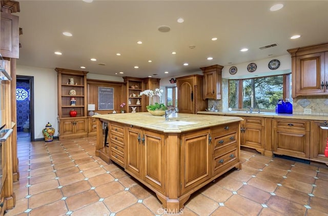 420 Inverness Dr, La Canada Flintridge, CA 91011 - kitchen with open shelves, a center island with sink, plenty of natural light, and tasteful backsplash