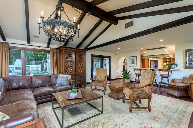 420 Inverness Dr, La Canada Flintridge, CA 91011 - living area featuring visible vents, arched walkways, a notable chandelier, vaulted ceiling with beams, and a wealth of natural light