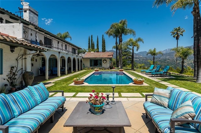 420 Inverness Dr, La Canada Flintridge, CA 91011 - outdoor pool with an outdoor living space, an outbuilding, a mountain view, a yard, and a patio