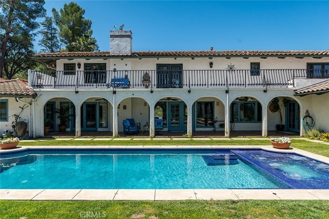 420 Inverness Dr, La Canada Flintridge, CA 91011 - rear view of house with an in ground hot tub, a patio, a chimney, and a balcony