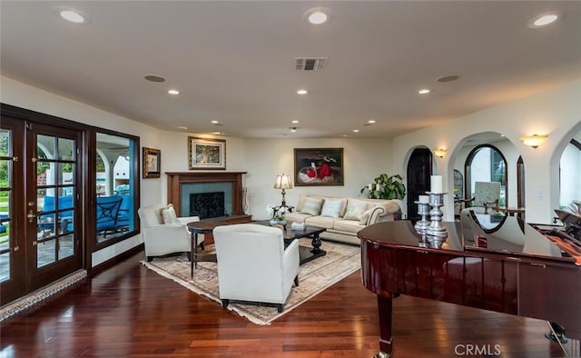 420 Inverness Dr, La Canada Flintridge, CA 91011 - living area featuring a fireplace with raised hearth, french doors, visible vents, and wood finished floors
