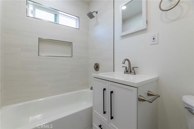 full bathroom featuring shower / bathing tub combination, vanity, and toilet