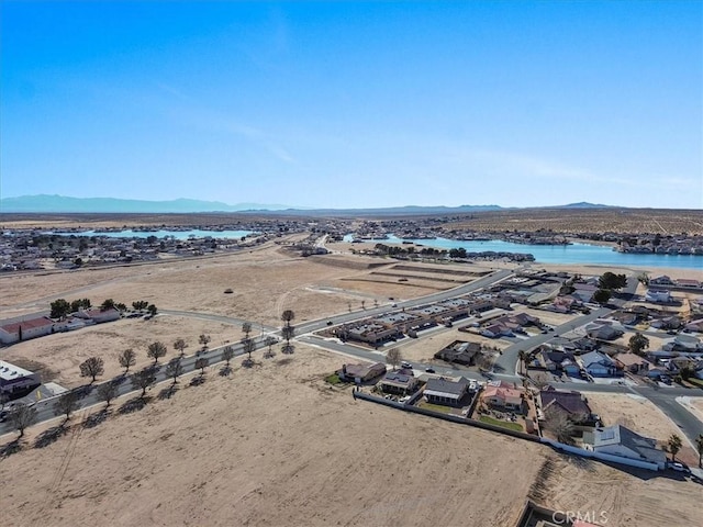 bird's eye view with a residential view and a water and mountain view