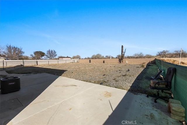 view of yard featuring fence and a patio area