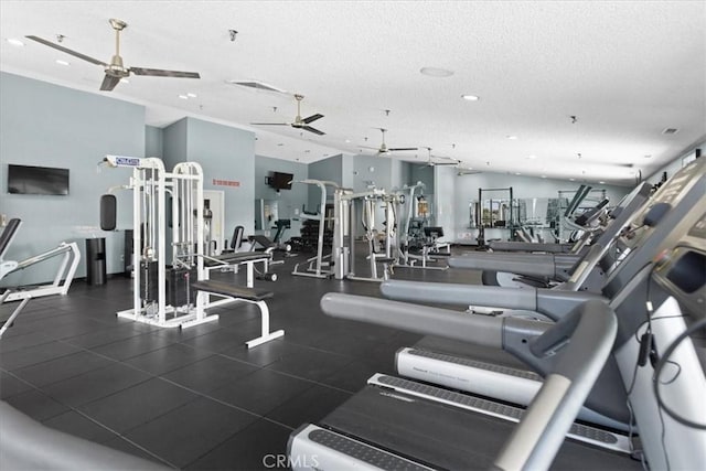 workout area featuring a textured ceiling, ceiling fan, and recessed lighting