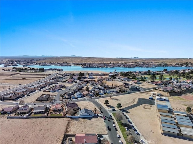 birds eye view of property with a water and mountain view and a residential view