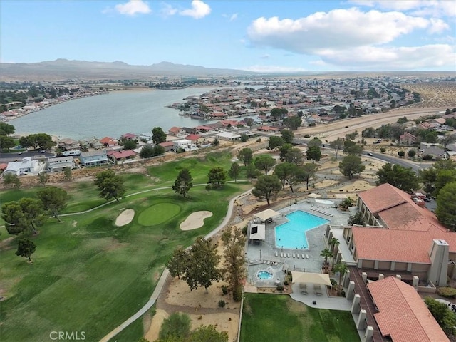 aerial view featuring a water and mountain view, a residential view, and golf course view